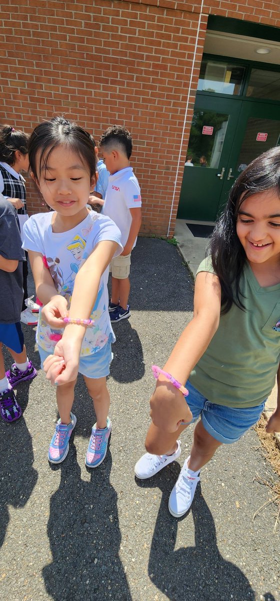 Smiles all around when we realized our bracelets were changing colors! #webelongatFairhill #aplaceofjoy #firstdayfun #bringthemagic