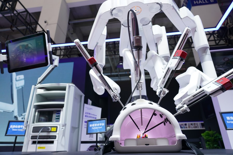 XHscitech's tweet photo. At the ongoing 2023 World Robot Conference (WRC) in Beijing, four large red robotic arms, featuring flexible wrists and high-torque designs, captivatingly demonstrated their industrial precision by welding a white car in the exhibition hall https://t.co/LrteOb9NjS https://t.co/RwFXJWjkMk