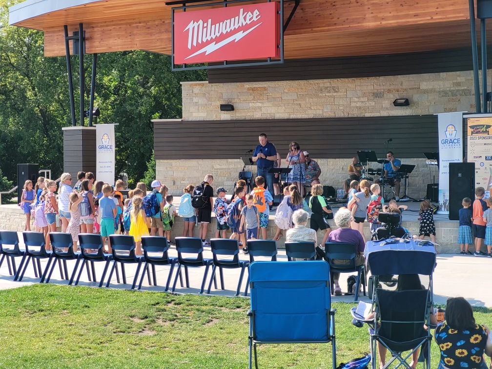 GraceMenFalls's tweet photo. Thanks for joining us for Worship in the Park at Menomonee Fall's Village Park this weekend! God's blessings to all, especially to our students who received a blessing on their backpacks for the start of the school year. https://t.co/trTFoDTu8y