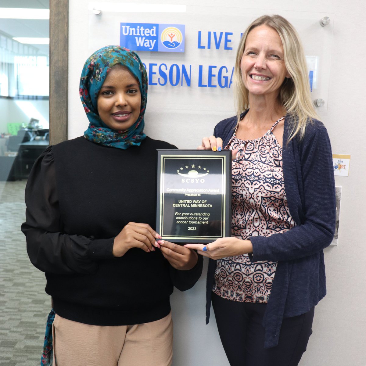 pfssmn's tweet photo. UWCM PFSS was honored with a lovely plaque from partner @SCSYOMN  for our support of their annual soccer tournament, and for our ongoing support of young people throughout the year. (SCSYO is especially grateful for the work of Ekram Elmoge, who we kind of LOVE 😍 too!) https://t.co/L79voHzhed