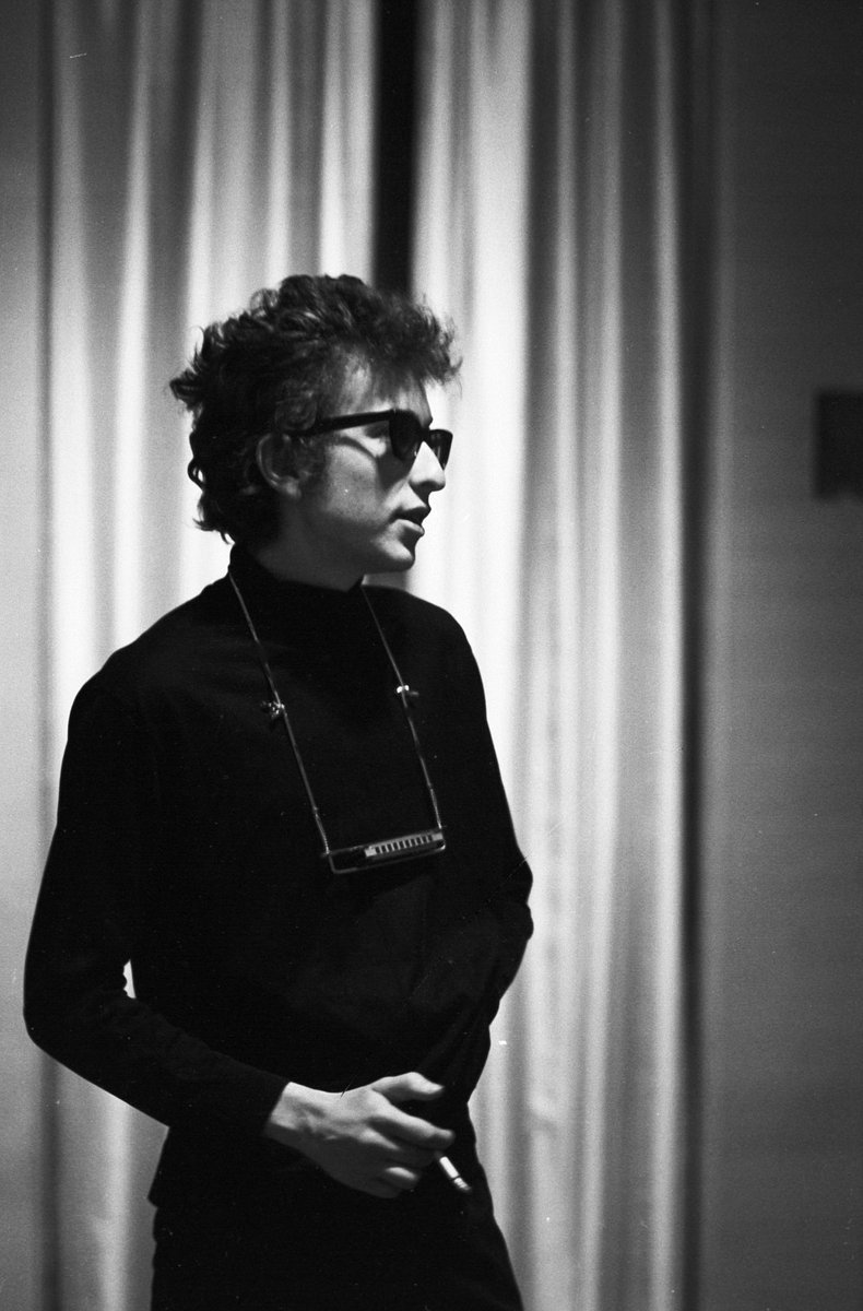Bob Dylan has a cigarette backstage at The Philharmonic Hall, NYC, 1964. 📸: John Byrne Cooke. #BobDylan #Dylan