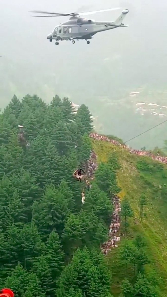 Reuters's tweet photo. Rescuers in Pakistan pulled all seven children and one man to safety after their cable car became stranded high over a remote ravine, officials said, ending an ordeal lasting more than 15 hours https://t.co/RxKEYJKXaj https://t.co/CglM8Cl8tg