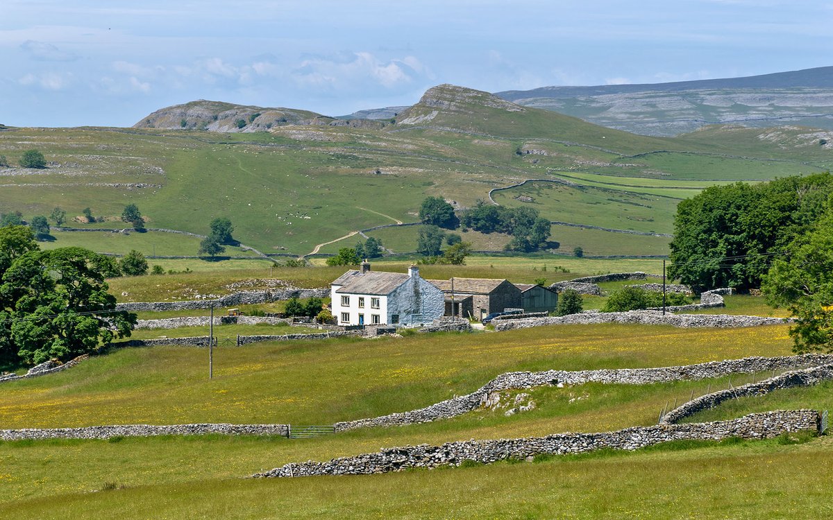 Winskill, with the limestone scars of Smearsett behind. Yorkshire Dales National Park.