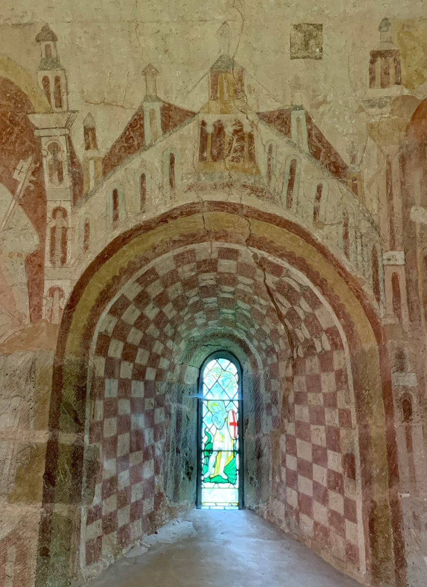 12th century decorated chancel window from St. Mary’s Church at Kempley in Gloucestershire. The walled city above the window is a representation of the gates of Jerusalem. #WednesdayWallpainting 📷 My own.