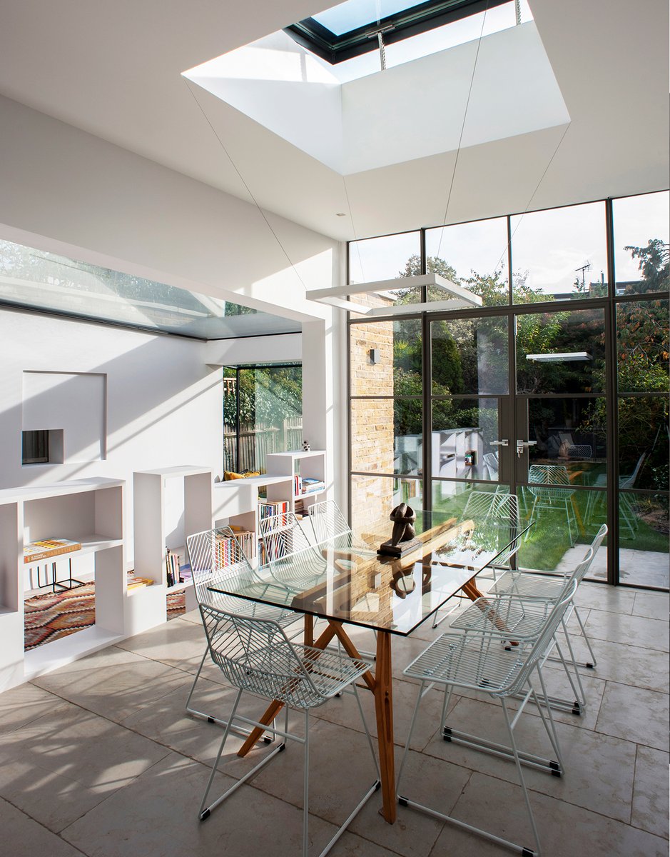 Photograph by Alessio Costantino of the #diningroom, with the #MCA_librobookshelf and our #MCA_white2 designed #hanginglamp in our extension project #MCA_Abstractbarnes in #London #Barnes #architecture #architettura #archdaily #archilovers  #interiordesign #archdaily #picoftheday