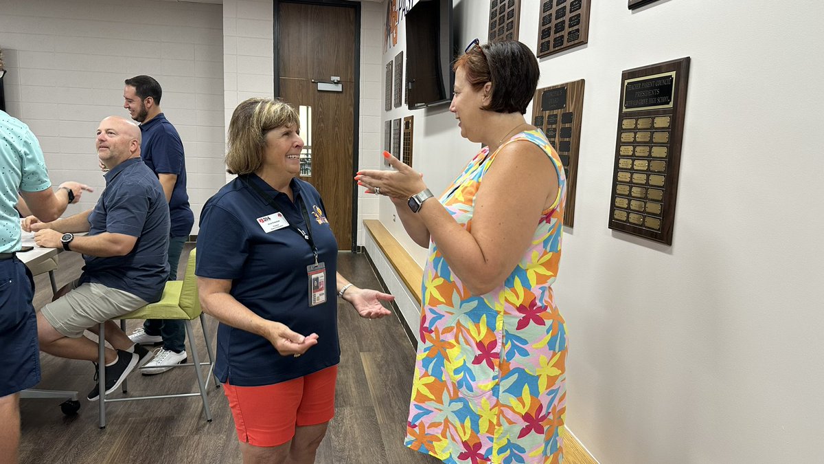 District214's tweet photo. The back to school breakfasts continue! @ScottRoweEdD and Board of Education President Alva Kreutzer kickstart the day with staff at @BG_Bison! #214firstdays https://t.co/Ou9RSRIUMy
