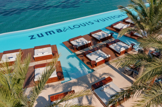 firstlookluxury's tweet photo. #FirstLook as @LouisVuitton takes over the pool at Zuma Mykonos. Until 4th Sept, the ocean-inspired takeover will come to life with #LouisVuitton monograms cloaking the pool beds and pool itself, transforming the space with the Maison’s modern, colourful and coastal aesthetic. https://t.co/i5b0H6whMQ