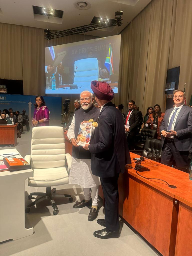 iamneerajkanwar's tweet photo. I am very proud to see my father, the Chairman of Apollo Tyres, Mr Onkar Singh Kanwar, as the Chair of the BRICS Business Council of the India Chapter, present the Annual Report of the Business Council to the Indian PM Narendra Modi at the BRICS Summit for Emerging Economies. https://t.co/wELWWzw5AB