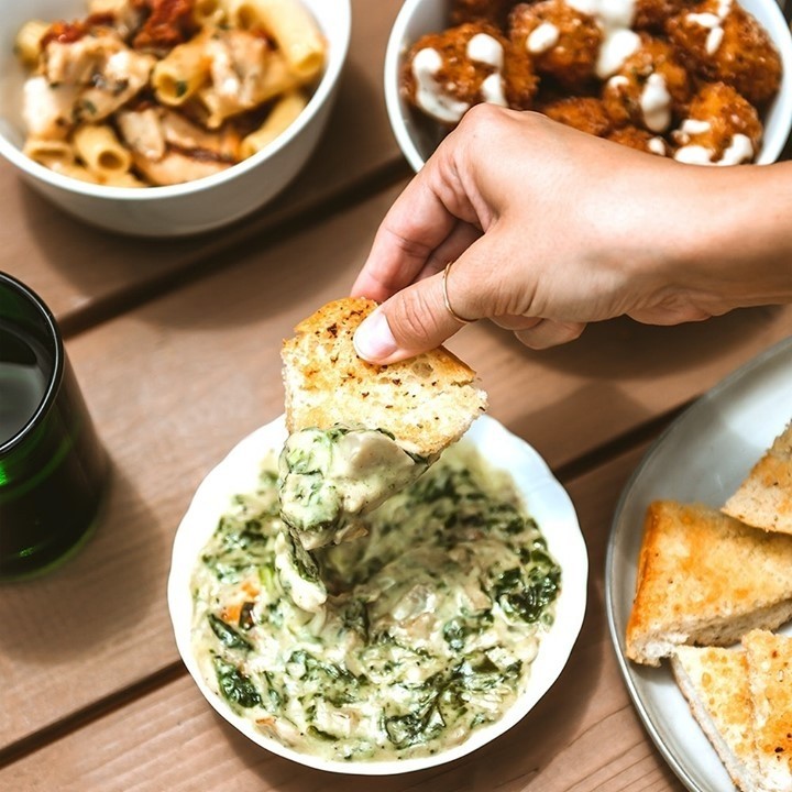 Dip, dip, hurray! Our Spinach + Artichoke Dip is made with artichokes, parmesan, mozzarella, white wine, and spice, served with garlic-brushed rosemary bread. Buon appetito!⁠