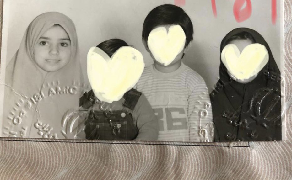 Sativa888's tweet photo. I will never ever forgive those responsible for ruining my childhood. What kind of perverted psychopath forces little kids to wear a hijab? It looks like my mom had to wrap a sheet around our faces for this passport photo 🤢
#IranIsOurTemple 
#Iran 
#MahsaAmini https://t.co/pMGELTDGVw