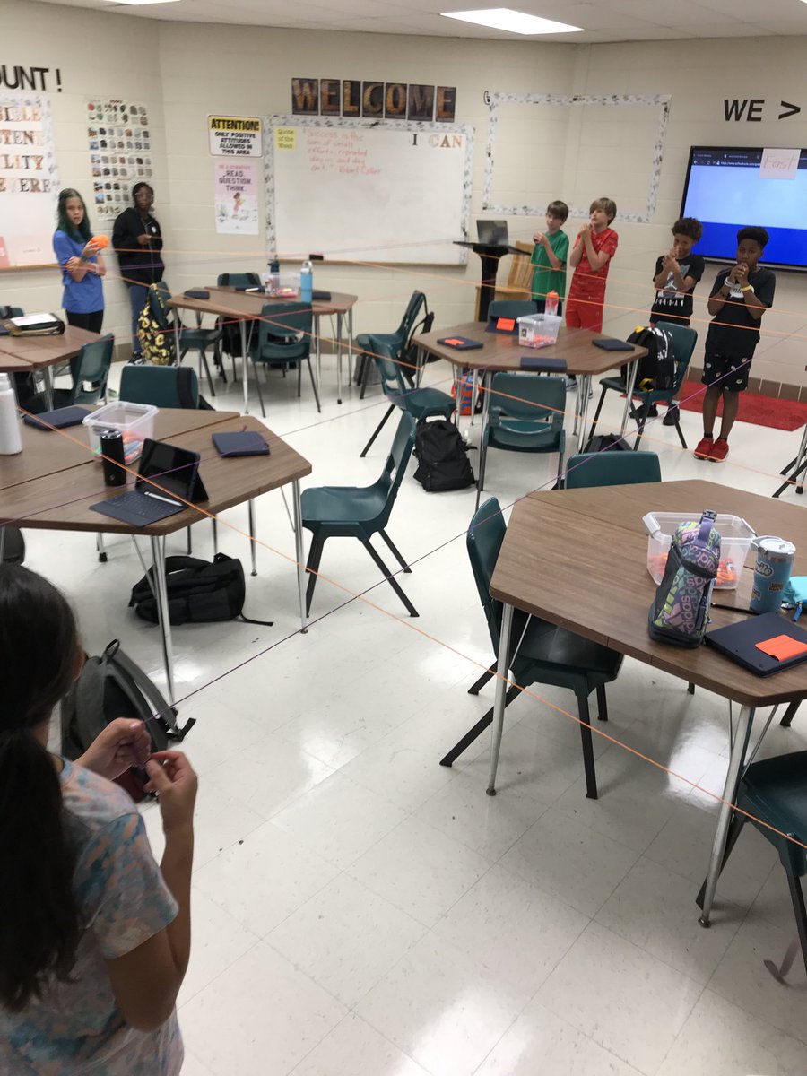 Using different colored yarn to make interactive Latitude/Longitude lines making a human coordinate plane #oneAthens #amseagles