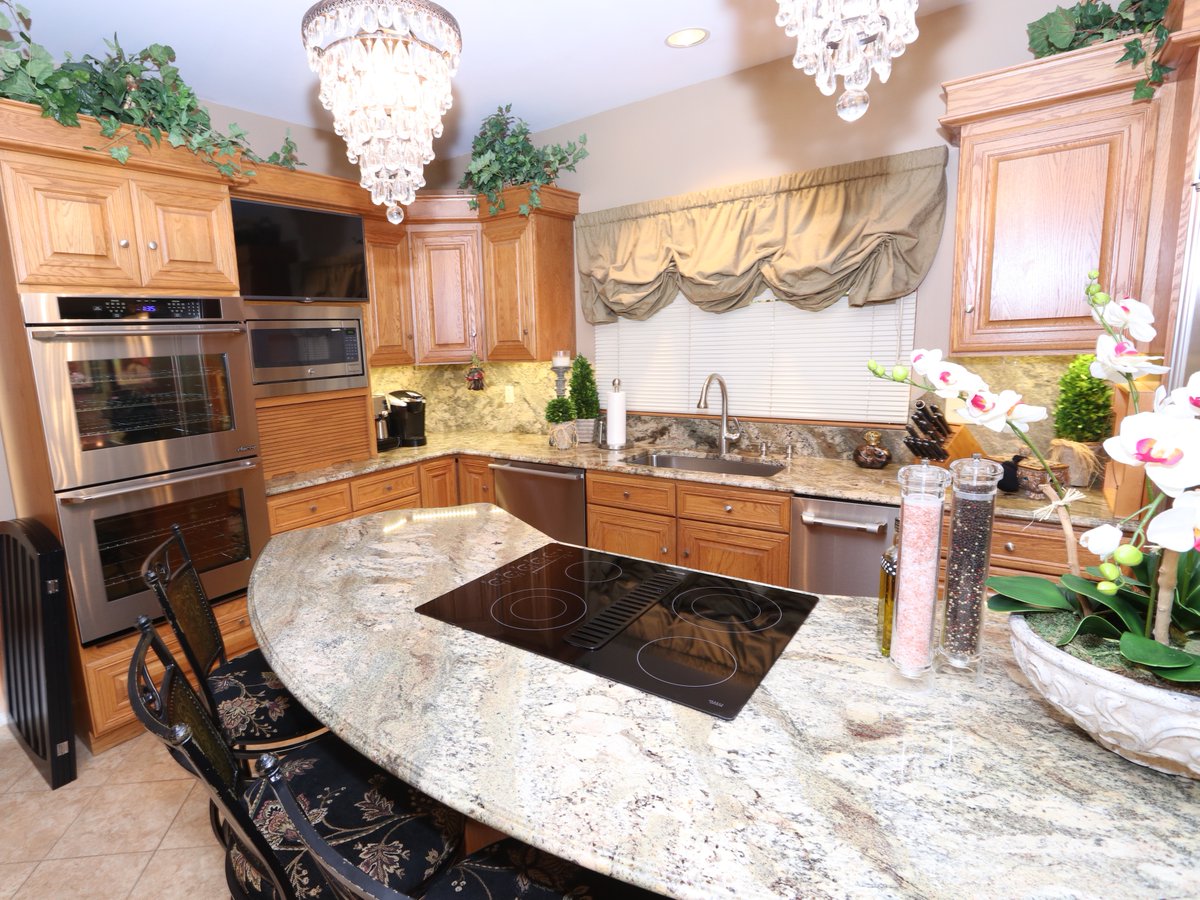 The pairing of the granite with the classic, wood cabinetry makes for an warm, inviting kitchen that every family will love to gather 'round.

For a free consultation, call (412) 429-9324 or visit premiergranite.com