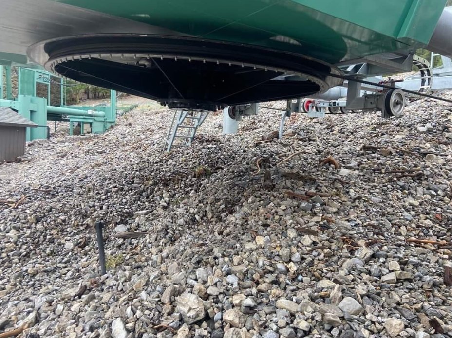 RenoFireWxIMET's tweet photo. Incredible debris flow/flooding damage from #Hilary.  That ski lift is buried in about 10 feet of mud and rock.  Here's what it's supposed to look like vs. today. @NWSVegas https://t.co/ZWH9nvRdFp