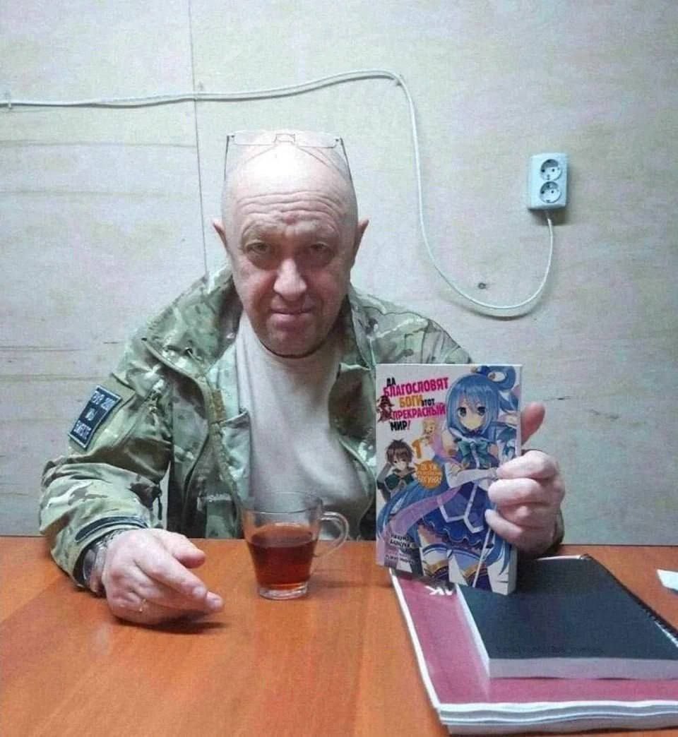 TopGyaru's tweet photo. Russian mercenary group Wagner announced it's former leader's death with a picture of him holding a Konosuba light novel😭 https://t.co/pcL6F2alsz