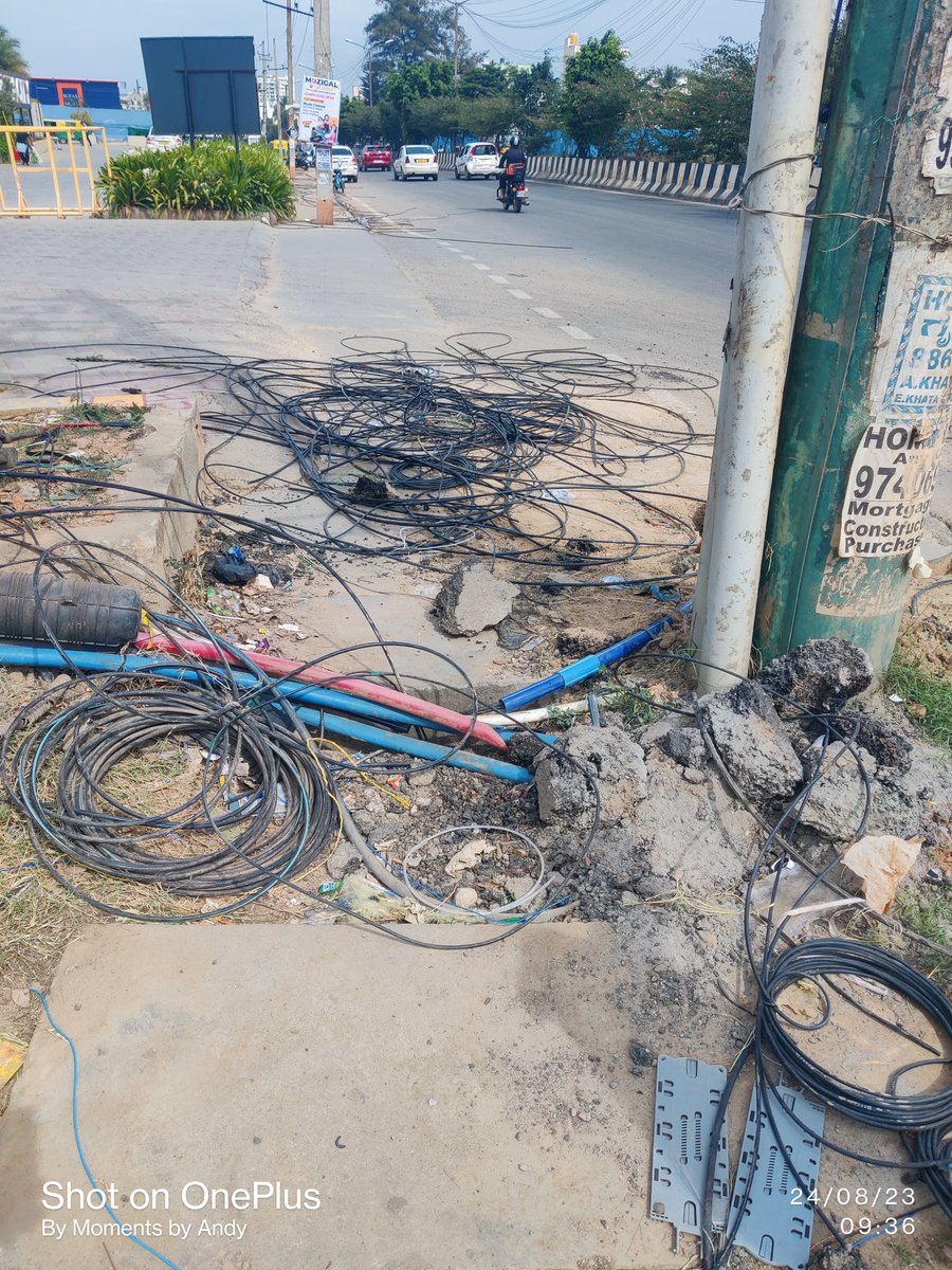 StopFitz's tweet photo. Look at the mess created by @NammaBESCOM. ok you removed illegal wiring but what about the cleaning. The whole foot path have been dirty and the wires have been left in front of apartments. Who ll clear the mess around.@narendramodi @BescomTa @mnreindia @DKShivakumar https://t.co/GAuiN84WI0