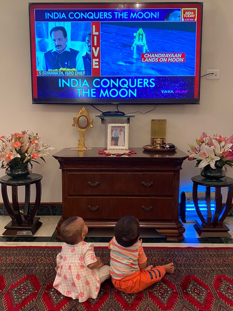 LtGovDelhi's tweet photo. My grandchildren were fascinated to watch the #Chandrayaan3Landing on Chanda Mama, last evening ! 

Just captured my 'two cute moons' together, while they were immersed in India's success on the moon ! https://t.co/5YzlQa7CMq
