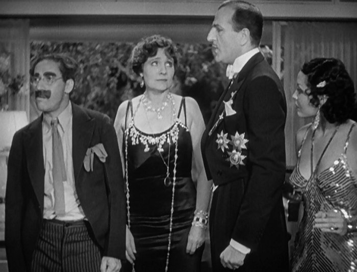 #MrsTeasdale: I want to present to you Ambassador Trentino. Having him with us today is indeed a great pleasure. #Trentino: Thank you, but I can't stay very long. #Groucho: That's an even a greater pleasure! #DuckSoup 1933.