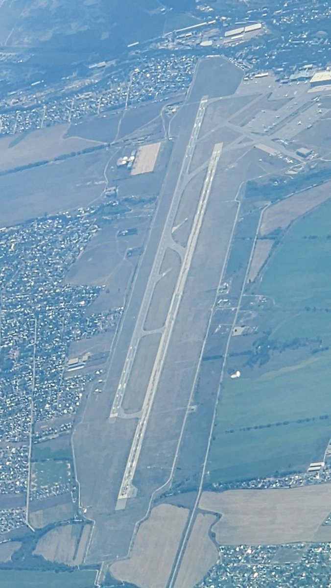 kclepley's tweet photo. When I was on the MD-11, we did not have the fuel capacity to fly ICN-CGN nonstop with much cargo.  Therefore,  we would land here in Almaty, Kazakhstan, for a fuel stop and change of crews.  

They have two 14000+ foot runways (23L/5R and 23R/5L).  The one on the left was built during the Cold War era.  It made for a fun ride near V1 due to the patchwork.  

The one on the right was constructed in 2008.  It is 328 feet (100 m) longer and much smoother.  

Such a fun place to visit if you love history.