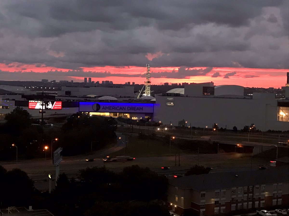 JesseWittenrich's tweet photo. Gorgeous pink sky over Manhattan and the American Dream Mall this morning. Ready for today!!

#botcon23 https://t.co/0a8cL99CbW