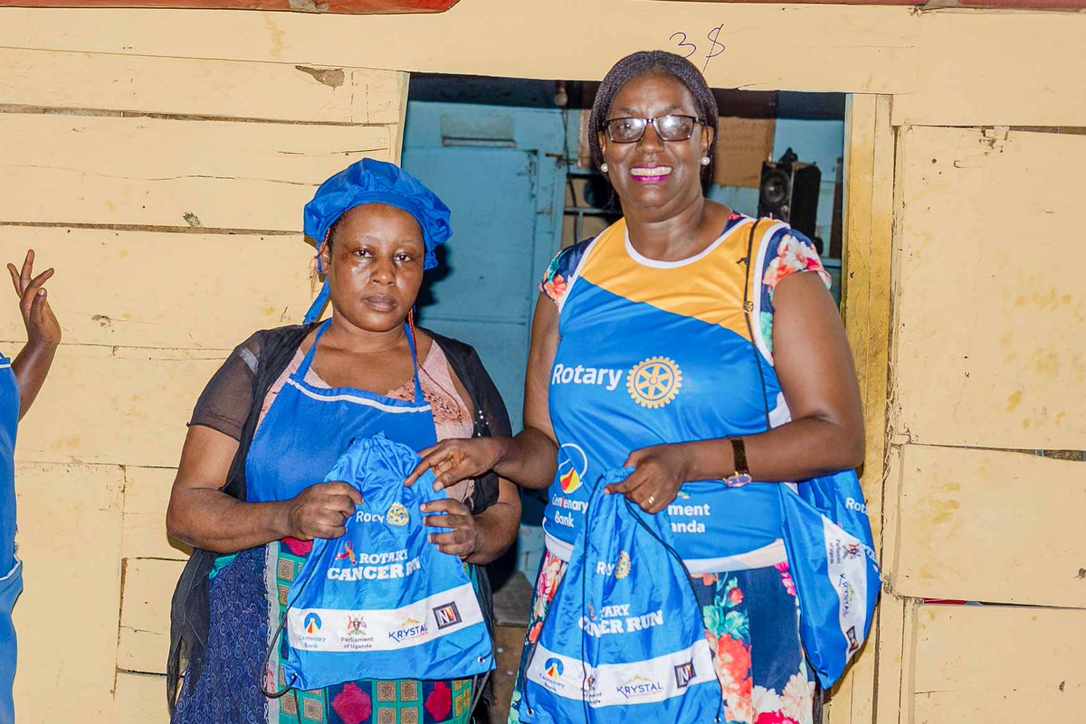 HCP Edith Kakuba giving cancer run kits during our Cancer Run activation in Bukoto