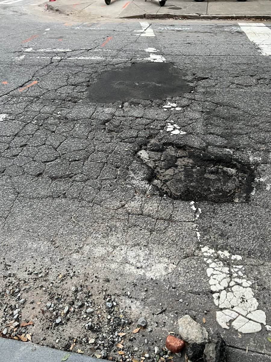 djfeldma's tweet photo. Seriously, @ATL311, you did one but not the one right next to it on east side of 8th at Juniper ??? @AmirForATL @andreforatlanta https://t.co/erqo6VUPry