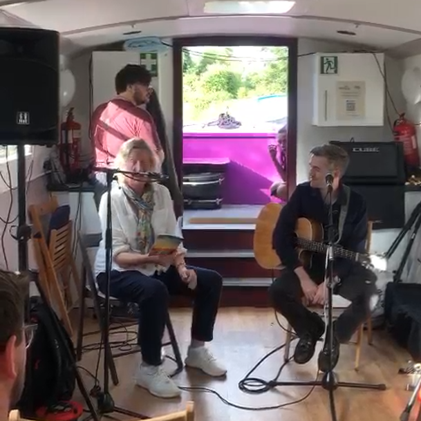 PoetryCLP's tweet photo. I read one of my poems - 'Stations' - from my latest book 'Living with Joy'  on a canal barge at the kind invitation of Irish singer songwriter Colin Andrew. This talented guy gave me a spot during his Edinburgh Fringe gig! #edinburghfringe #poetry #poetrycommunity https://t.co/Q3mBRAV6mz