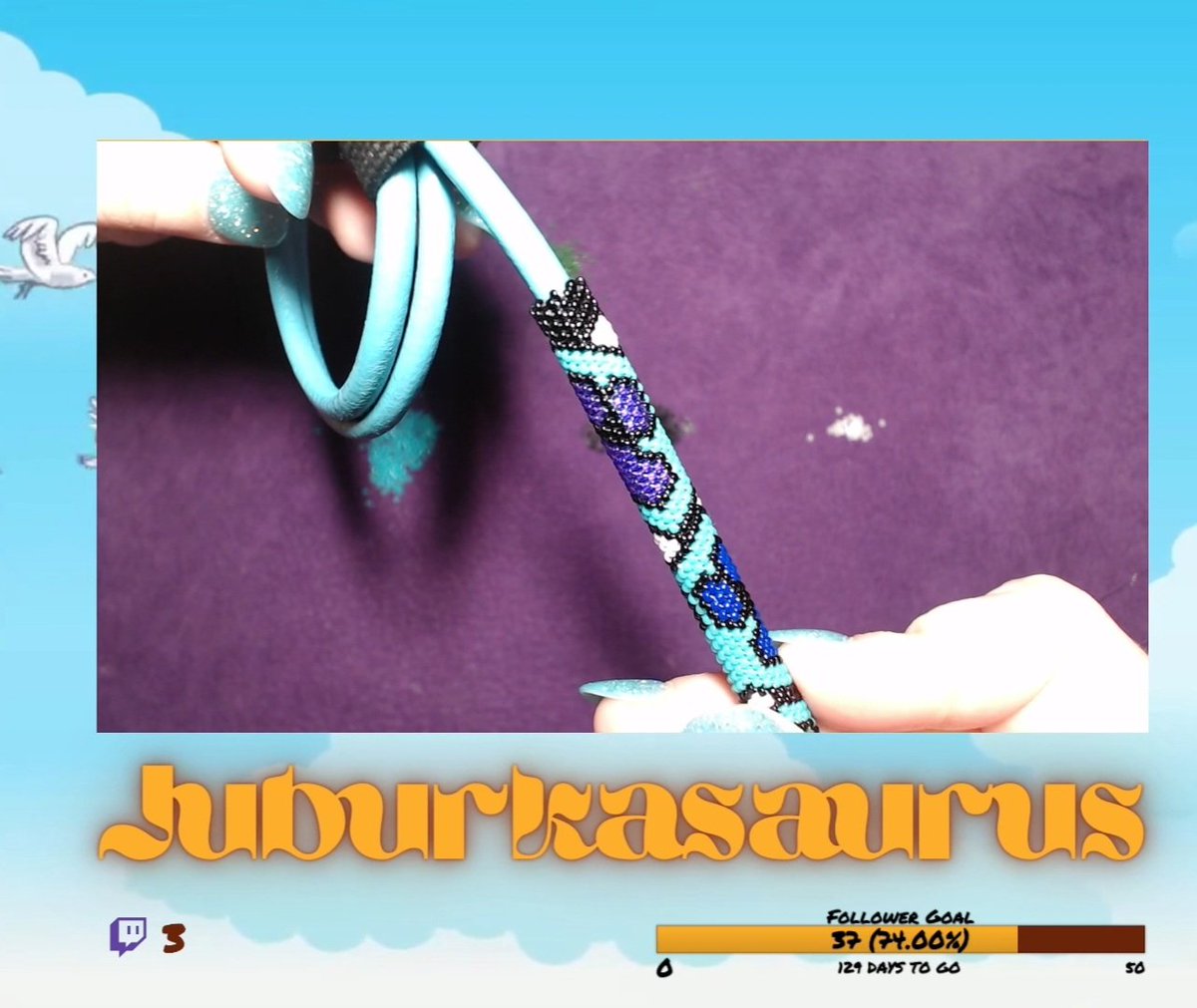 Juburkasaurus's tweet photo. A good little snapshot of what I was working on in the stream yesterday. It is going to be a necklace, with rainbow paw prints. So you can see I have the purple and blue done and we are just continuing down the line. https://t.co/cZvtCosfmX