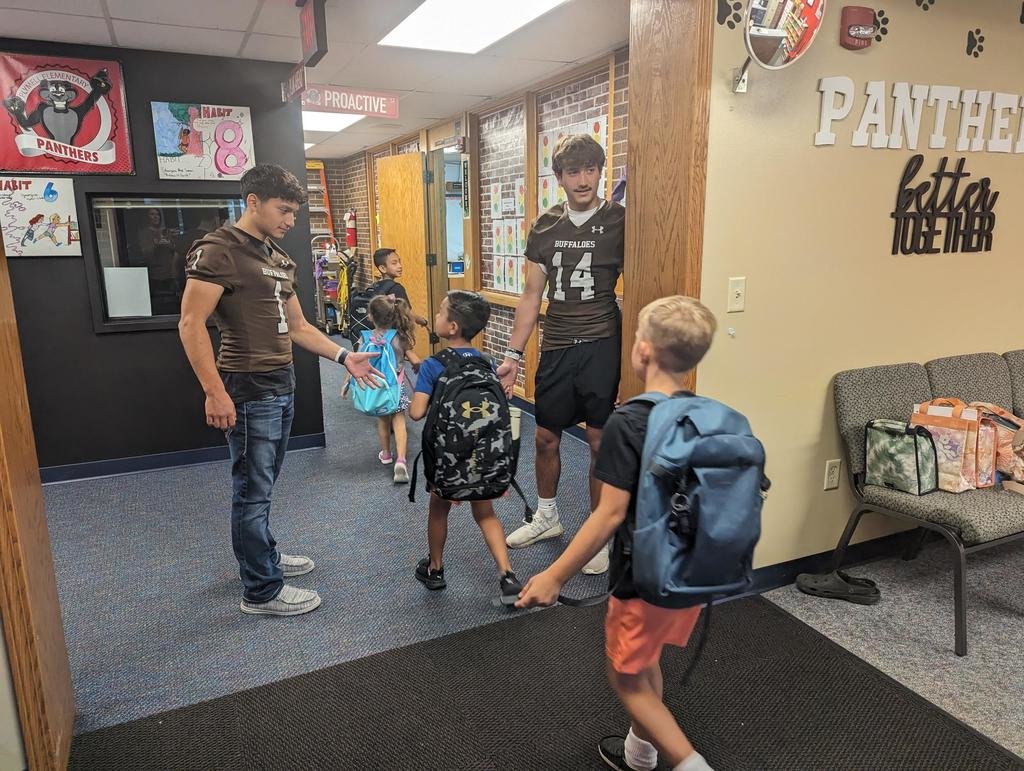 USD457's tweet photo. The GCHS football players were at Plymell Elementary School yesterday morning greeting students and giving high fives. The team will participate in a scrimmage at Wichita-Heights tomorrow at 6:30pm. https://t.co/y87elzxnud