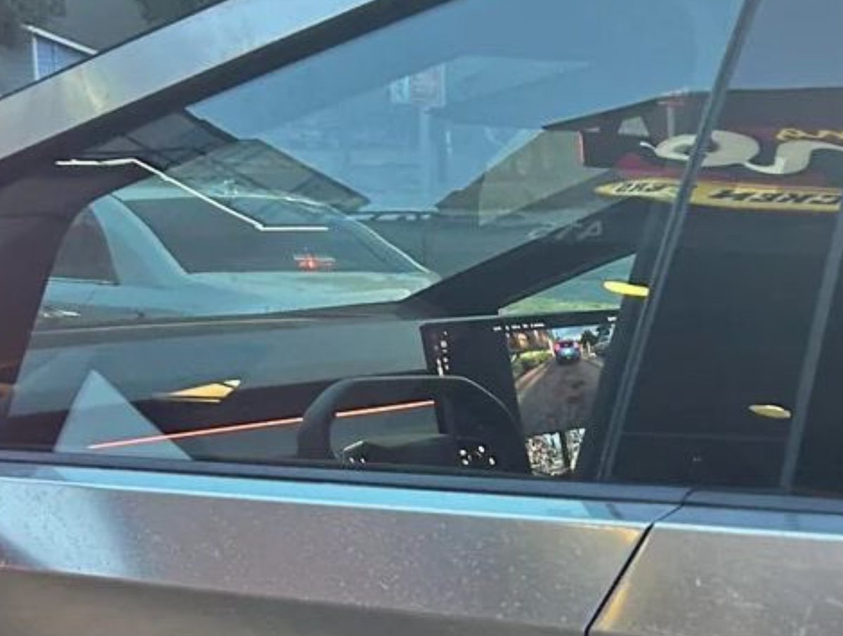 IgnitionXMedia's tweet photo. Interior of the production-ready Cybertruck. We can see there is a red strip of ambient lighting going across the dash. 

We can also see Tesla will be moving away from interior trim pieces altogether with the CT and the upcoming Model 3 Highland. https://t.co/qceyap0gKx