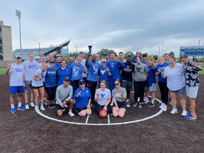 Alnutt41's tweet photo. The inaugural @UBAthletics staff kickball game was a success!! The Blue Team (my team) walks away with the trophy!! Great to be out on the new turf at our @UBBullssoftball field!! ๐ค๐พ#UBFam #WorkHard #PlayHard https://t.co/dS6WA50hDF