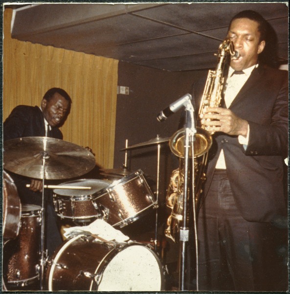 John Coltrane and Elvin Jones performing at the Jazz Workshop, photographed by Bernie Moss in 1964. Part of the Bernie Moss Collection, a series of photographs taken by jazz aficionado and supporter Bernie Moss, housed at the University of Massachusetts Amherst.