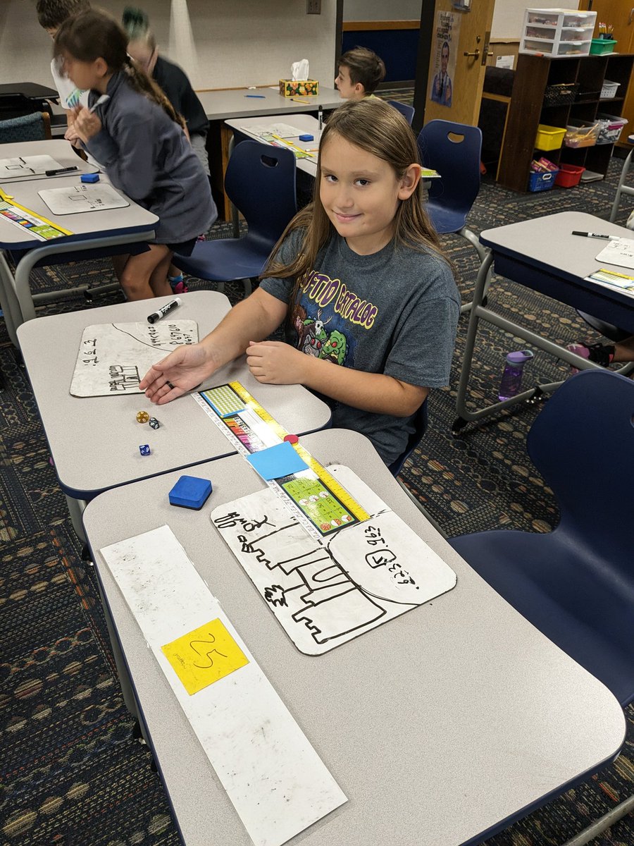 #partyof12 used our d10 dice to create decimals. The partner who created the larger number got to move the token one step closer to the other's "castle". A fun way to use our eureka lesson in a new and challenging way. #wearewayne