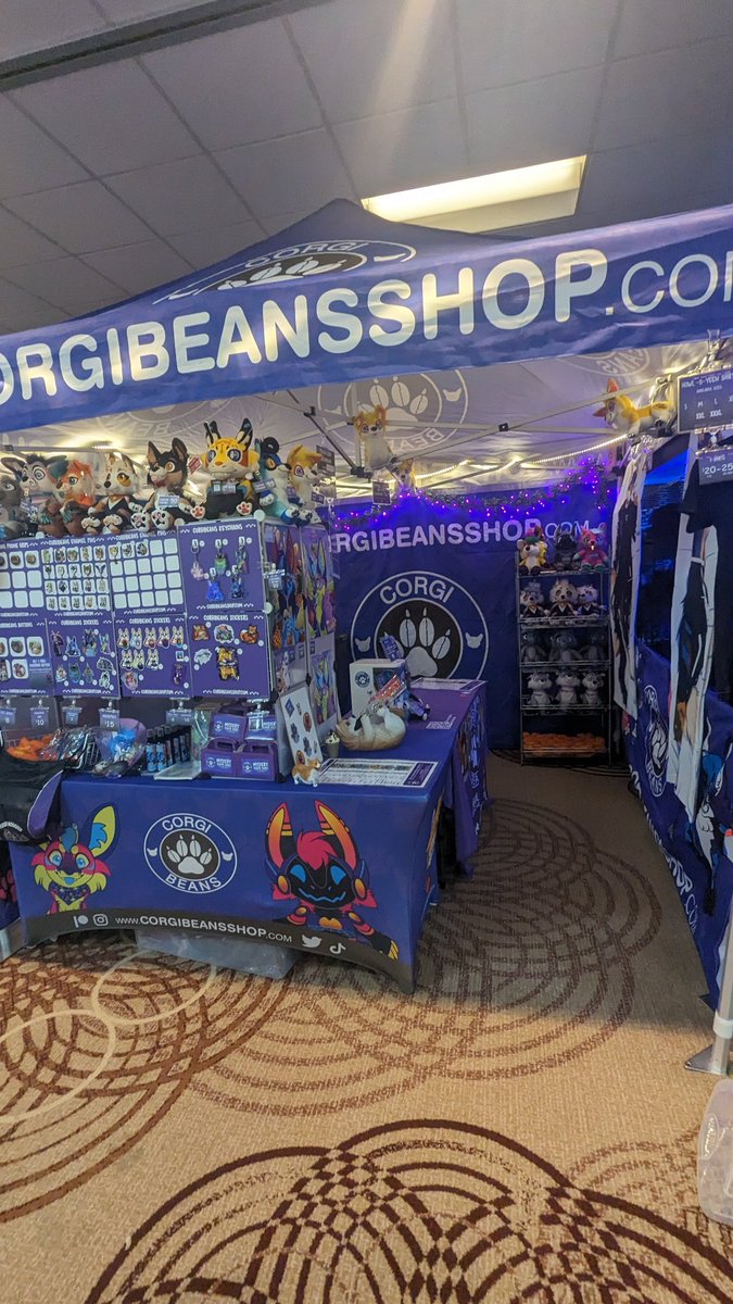 BuildAFur's tweet photo. We're all set up for tomorrow! Come check out our lil shop at @furrydelphia !!

#furry #furrydelphia #furrydelphia2023 #furryfandom #corgibeans #fursonaplush #furryplush #furrypins #furrytees #furrydakimakura https://t.co/Aa5uin0YBN