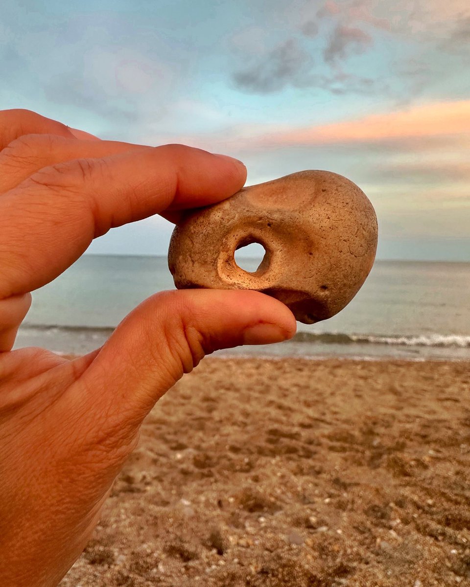 SouthbySW's tweet photo. This is my favourite hagstone find of all time. It even has finger and thumb holes for ease of holding up to the horizon. 
According to folklore, a stone with a natural hole through its centre has magical properties. Sounds good to me. 

It’s the little things… #folklorethursday https://t.co/lg2e2tephQ