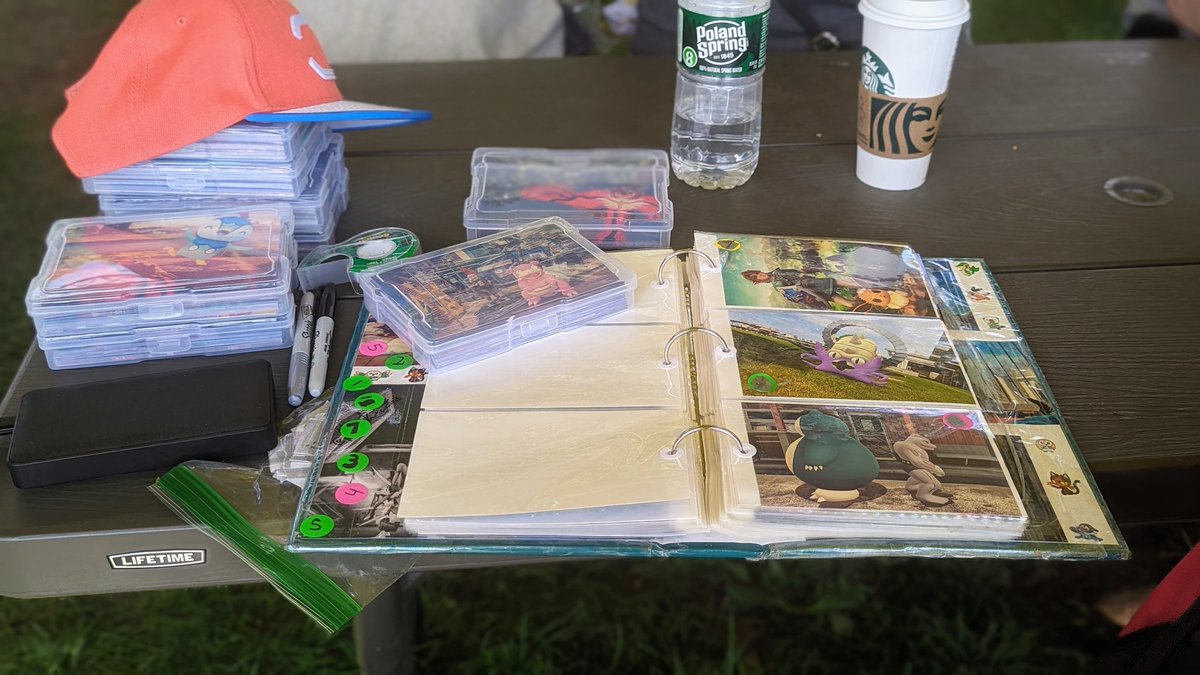 Chris_Snaps_All's tweet photo. "One Of My Setups At GO Fest!"
📸 Date: 08/19/2023
One of the couple impromptu setups I had at #GOFest, featuring my booklet of all the #GOSnapshot(s) I had available, and my cases of all the #ARPhoto(s) I had printed out.
#AshHat #GOFest2023 #PokemonGOFest #PokemonGOFest2023 https://t.co/BnDrOppY9K