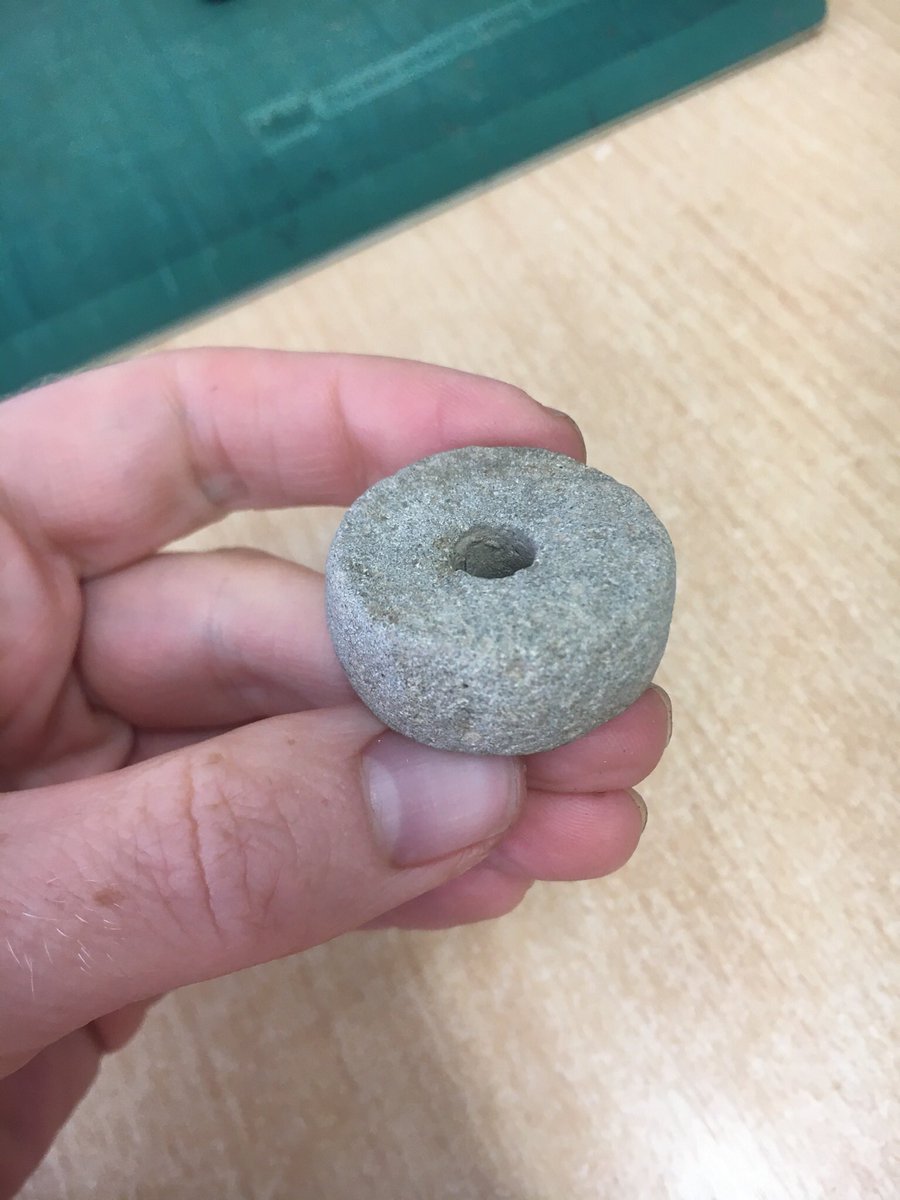 A beautifully worked and complete stone spindlewhorl for #FindsFriday. This is late #IronAge to #Roman in date.