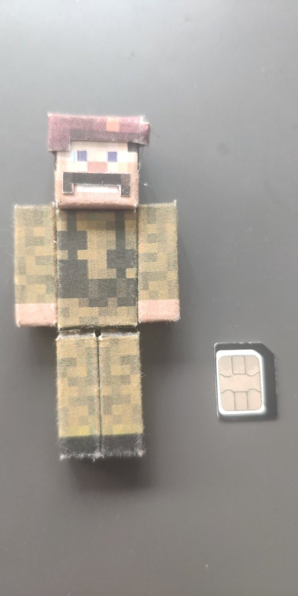 W92Baj's tweet photo. 10 yrs ago this was given to me by a young #mindcrack fan at our London #minecon party (I think! It was a long time ago). It's hand made from card (SIM for scale)

If you are out there, I still have it. It's still on my shelf.

Thanks @Minecraft for things like this. https://t.co/tPzvKEQ8tm