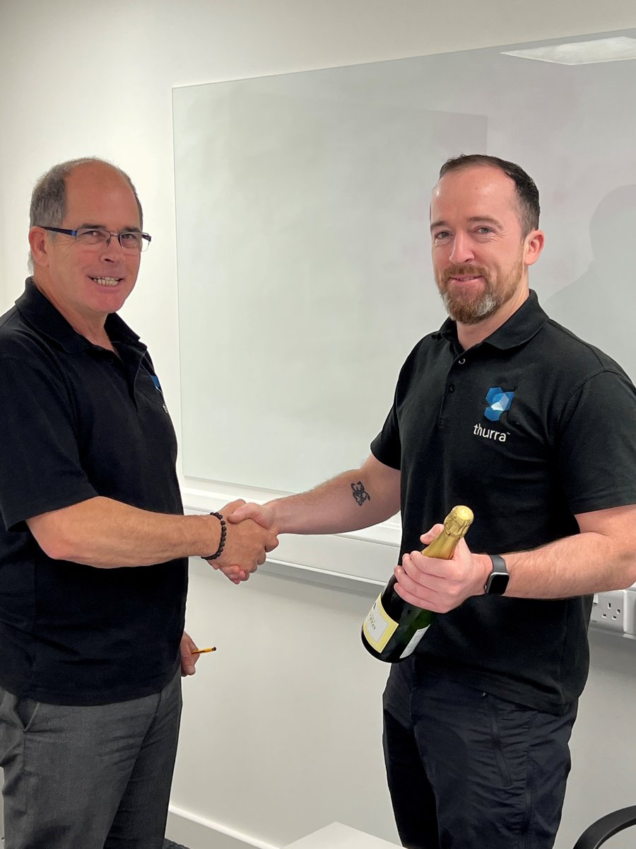 ThurraUK's tweet photo. Here's Kevin receiving a bottle of bubbly from our Technical Manager, Richard for 10 year service. Huge congrats Kevin. You are a much valued member of the team!

 #10YearService #WorkAnniversary #ValuedMember #Engineersurveyor #engineeringservices https://t.co/0dhqbjKsJa