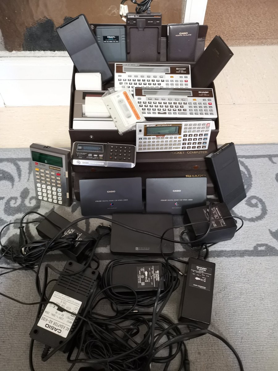 swartz_de's tweet photo. A job lot I recently picked up. A #PC1403, 2x #PC1500A, 3x #CE150 + cases, a #CE502A statistics module, calculators, some PDAs, an FA-1 & ~10 kg of copper in those power bricks. I don't normally buy lots, but it was 2 AM so I plead temporary insanity. #sharp #casio #ポケコン https://t.co/2KrhA0vkDn