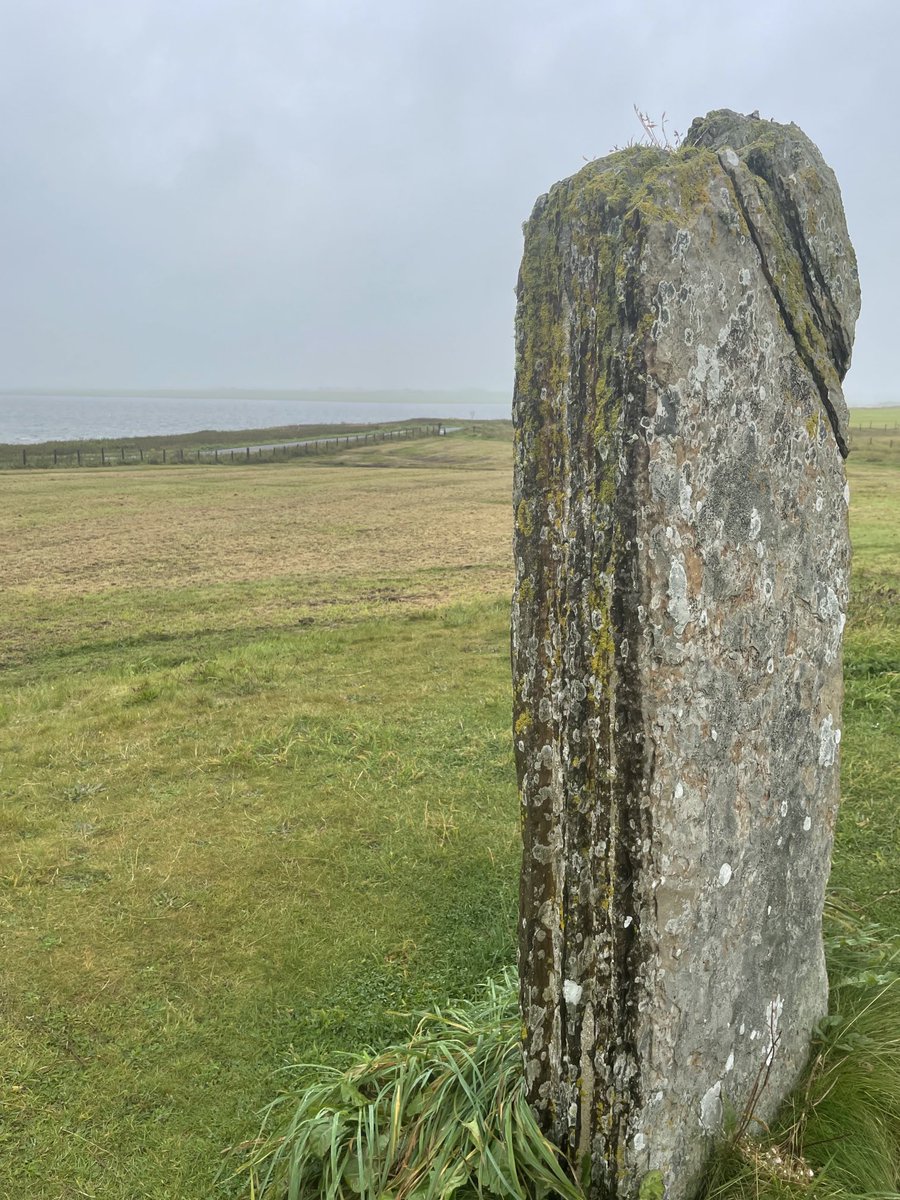 It’s a dreich day here so can’t quite see Maeshowe across the loch from the Comet Stone.