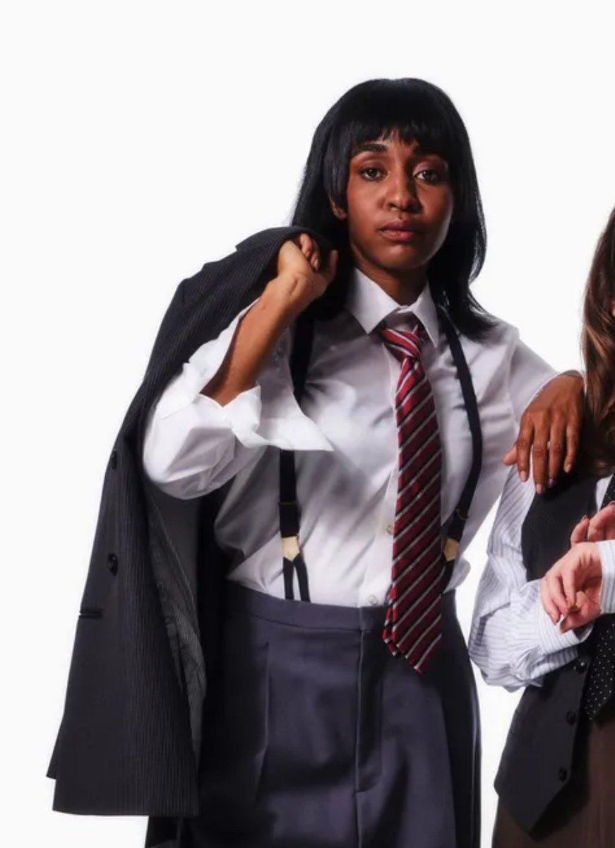 sapphicslike's tweet image. ayo edebiri in a suit