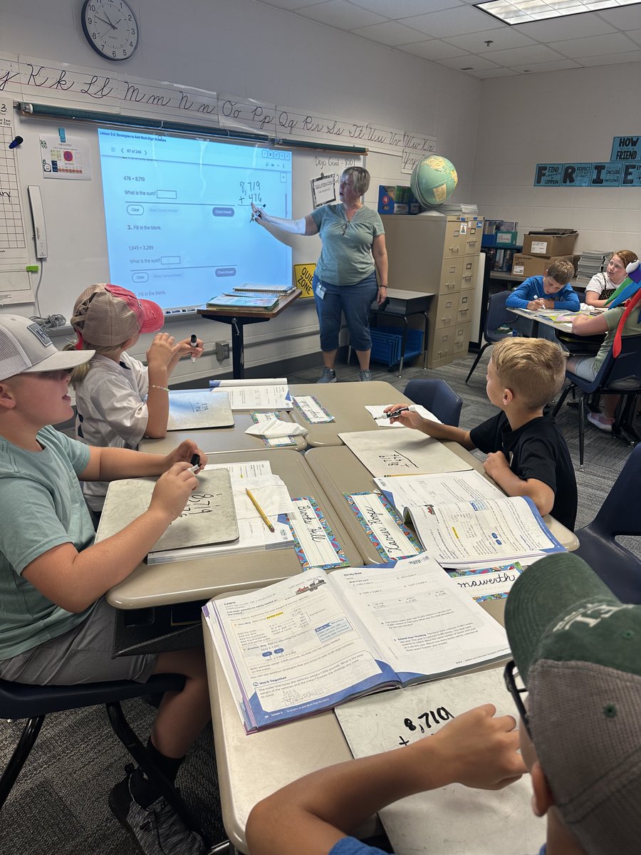 SunmanEl's tweet image. Mrs. Hountz is explaining to her 4⃣th Graders the importance of lining up place values when finding the sum.
#learningobjective: I can add multi-digit numbers
#numbersense #academicvocabulary #HowMuchWeCanGrow #WatchSunmanDearborn