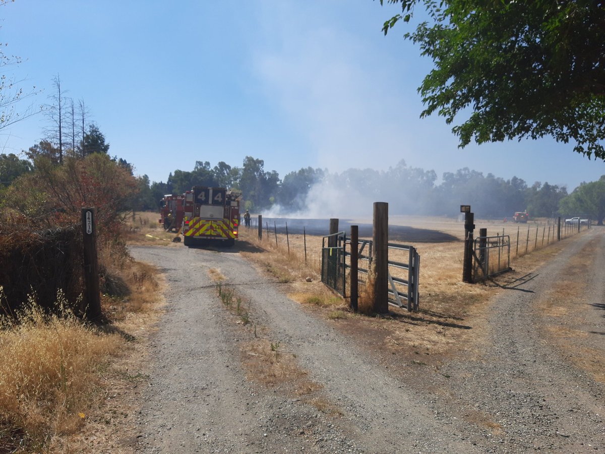 CALFIRE_ButteCo's tweet photo. Firefighters at scene of a vegetation fire in Nord off of Meridian road. 1/2 acre of grass, hose around fire. Resources will be at scene the next hour working on full containment and control #Kansasfire https://t.co/bbPfaCXmr7