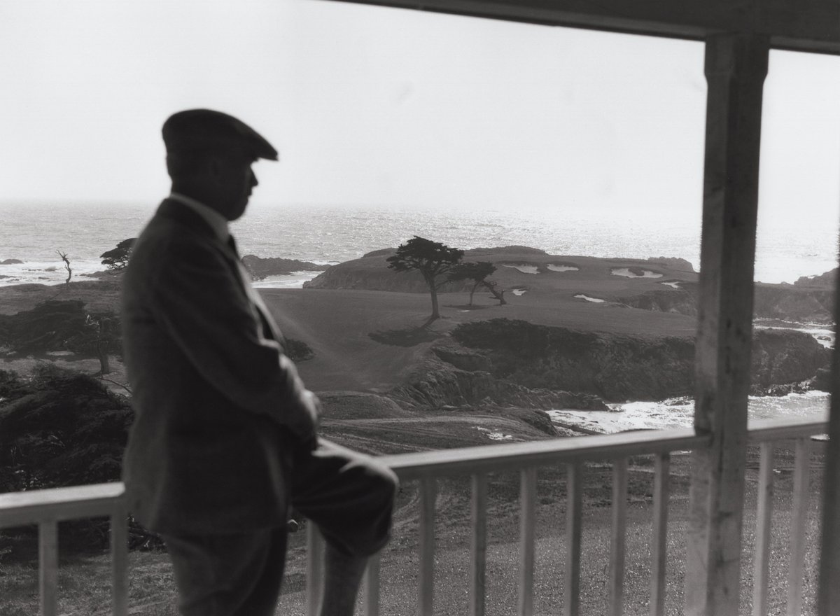 The Good Doctor on the veranda at Cypress Point — Pebble Beach, California — overlooking the Par 3 Sixteenth Hole (circa 1930).