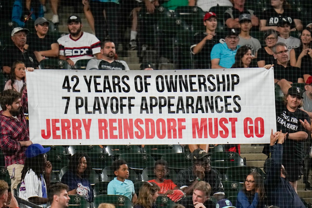 Fans hold up a banner during the ninth inning of the Tigers-#WhiteSox game Friday night. (Erin Hooley/AP)