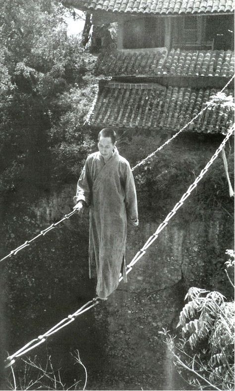 Simple bridge made from two chains in China, circa 1930