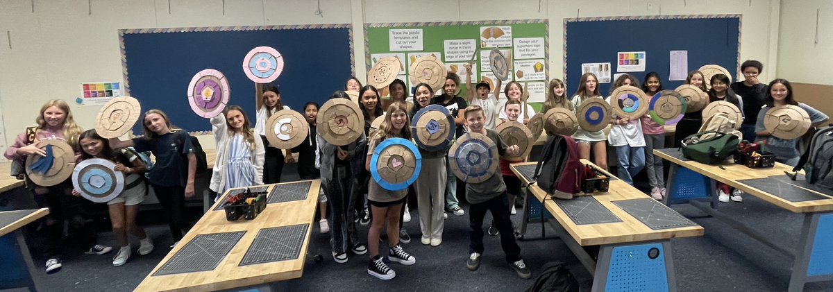 mrssnyder007's tweet photo. What can I say?! Today we wrapped up the 1st week of rotations thru @VIDASHARKS iStudio with @Mr_Brumbaughโs design lab. Sts practiced elements of the 1st Dimension of Product Design by using templates, box cutters & hot glue to assemble superhero shields. #innovatedesigncreate https://t.co/9EklSBaj2j