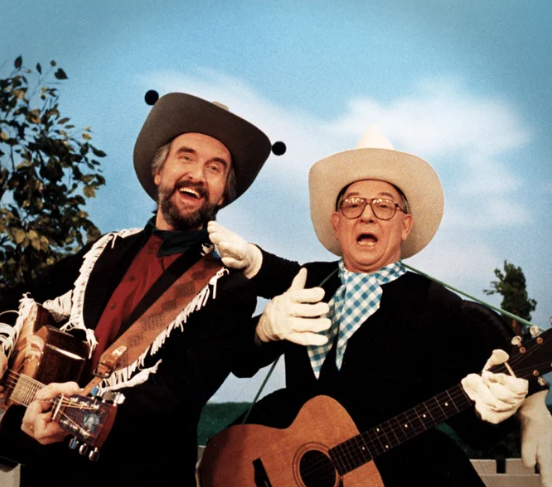 Fred Penner and Mr. Dressup is a pretty great crossover, but the story behind it carries some tragedy. 

About two weeks before he was to appear on Fred Penner's Place in 1992, Ernie Coombs' wife Marlene was struck &amp; killed by a car while she was out shopping in Toronto.

Penner