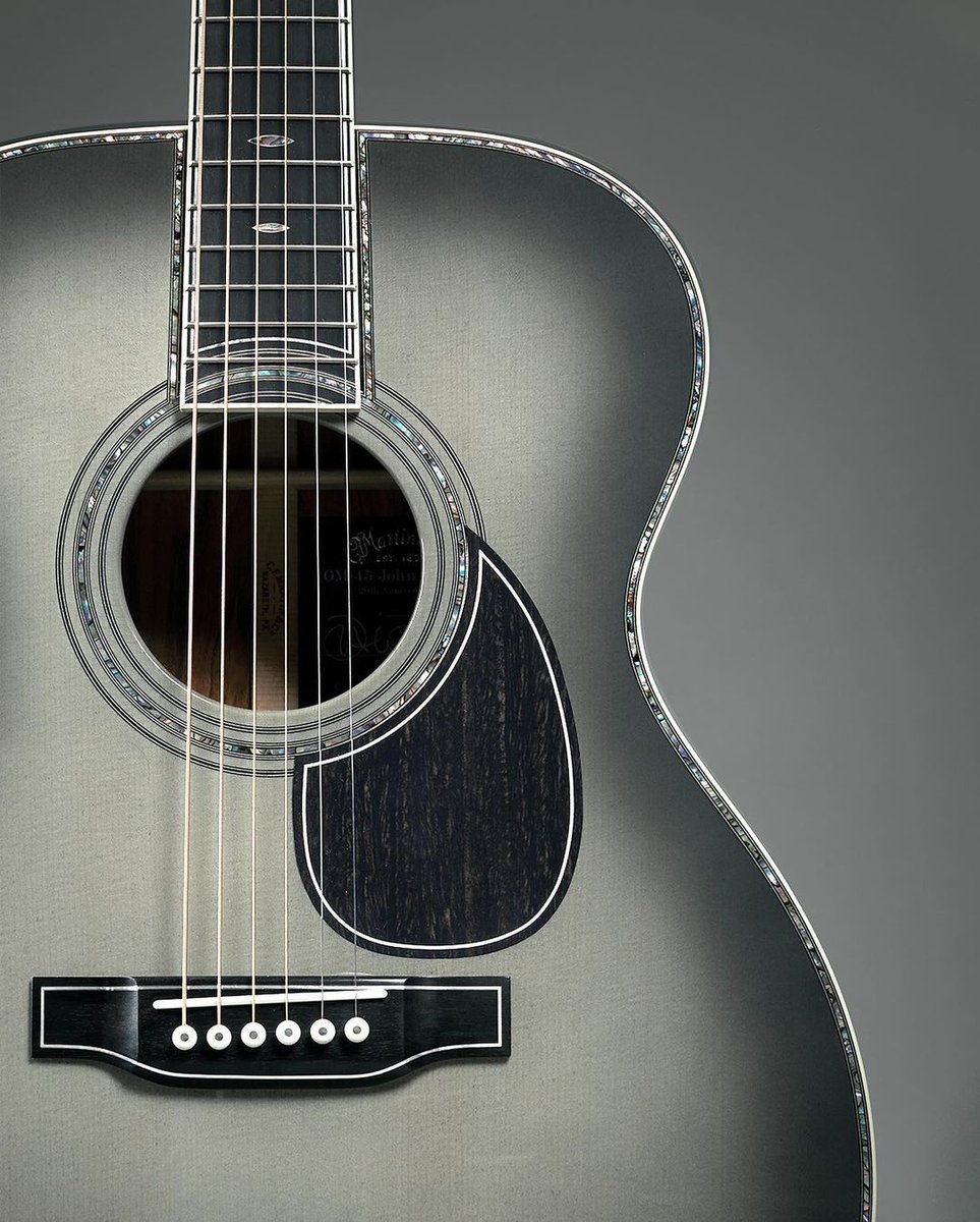 JohnMayer's tweet photo. When @MartinGuitar and I first developed the OM28-JM back in 2003, I could never have imagined the relationship would span 20 years, so when the idea for a very special anniversary model was brought up, I jumped at the chance to develop something extraordinary with the Martin Custom Shop. The result: the new Martin OM-45 John Mayer 20th Anniversary edition. The guitar is the pinnacle of what can be executed by hand by the Custom Shop’s world class master builders. Together with Martin, we developed a new wood stain named Platinum Gray Burst. Two things immediately became important to me: first, that we offer the same new color on the standard production model OMJM guitar, so that it wouldn’t be out of reach for anyone who wanted to own the OMJM, and second, that the guitars not be limited by number but by being available for only one year. The result is a pair of instruments that both celebrate our working together for two decades as well as elevate the Martin OMJM model to new heights. I can’t wait for you to see and hear one in person. For more information, head to https://t.co/tCPAHr5ZLm.