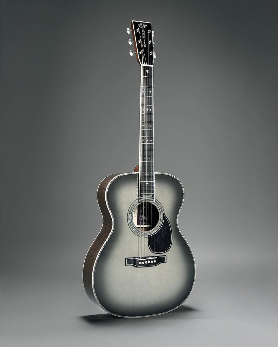 JohnMayer's tweet photo. When @MartinGuitar and I first developed the OM28-JM back in 2003, I could never have imagined the relationship would span 20 years, so when the idea for a very special anniversary model was brought up, I jumped at the chance to develop something extraordinary with the Martin Custom Shop. The result: the new Martin OM-45 John Mayer 20th Anniversary edition. The guitar is the pinnacle of what can be executed by hand by the Custom Shop’s world class master builders. Together with Martin, we developed a new wood stain named Platinum Gray Burst. Two things immediately became important to me: first, that we offer the same new color on the standard production model OMJM guitar, so that it wouldn’t be out of reach for anyone who wanted to own the OMJM, and second, that the guitars not be limited by number but by being available for only one year. The result is a pair of instruments that both celebrate our working together for two decades as well as elevate the Martin OMJM model to new heights. I can’t wait for you to see and hear one in person. For more information, head to https://t.co/tCPAHr5ZLm.
